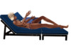 couple kissing chaise