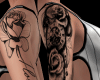 E} flower arm tattoo