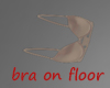 UC nude bra on floor