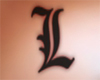 L letter breast tattoo