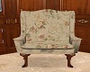 ^Beige floral wing chair